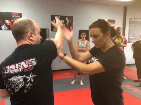Image of Eric and Shannon demonstrating self defense techniques