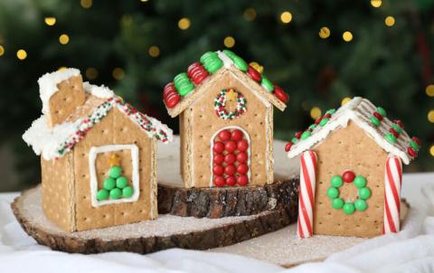 Photo of three graham cracker gingerbread houses.