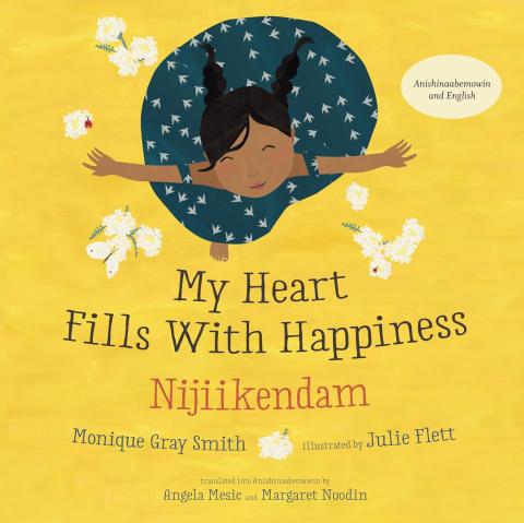 The cover of a children's book titled My Heart Fills With Happiness / Nijiikendam, featuring an illustrated child with outstretched arms, surrounded by white flowers, on a bright yellow background.