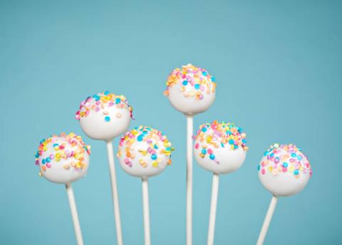 Image of cake pops with colorful sprinkles.