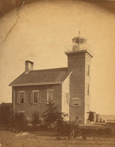 Image of Sand Point Lighthouse with lightkeeper Mary Terry 