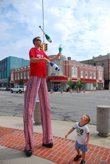 Image of Joel Tacey on stilts